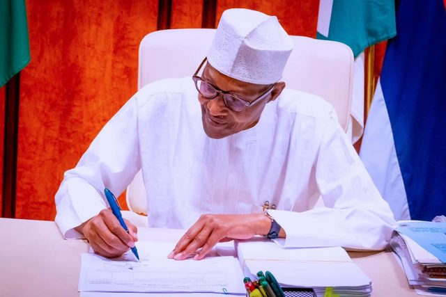 President Buhari signing the Petroleum Industry Bill into law