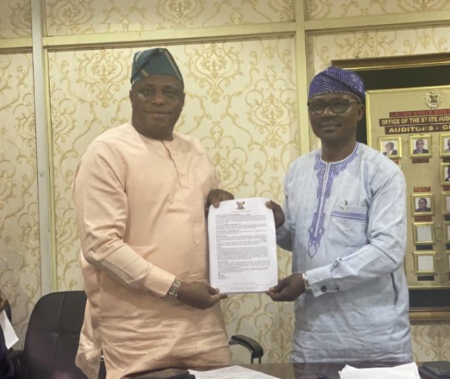 Accountant-General, Dr. Muritala Sefiu Abiodun with the State Auditor-General, Mr. Sikiru Adeniji Salami at the signing of the Y2021 audited financial statement.