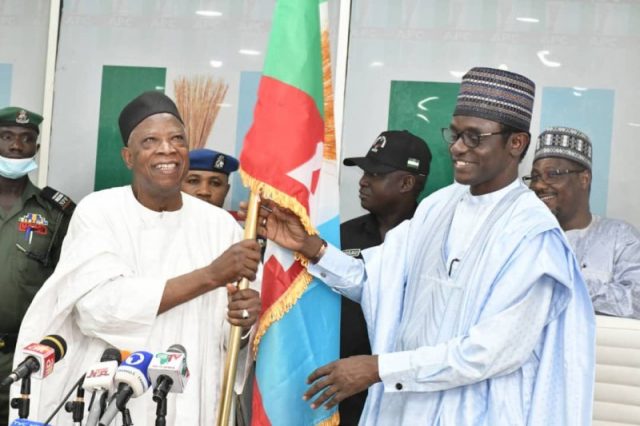 Senator Adamu being presented with the instrument of office on 30 March 2022