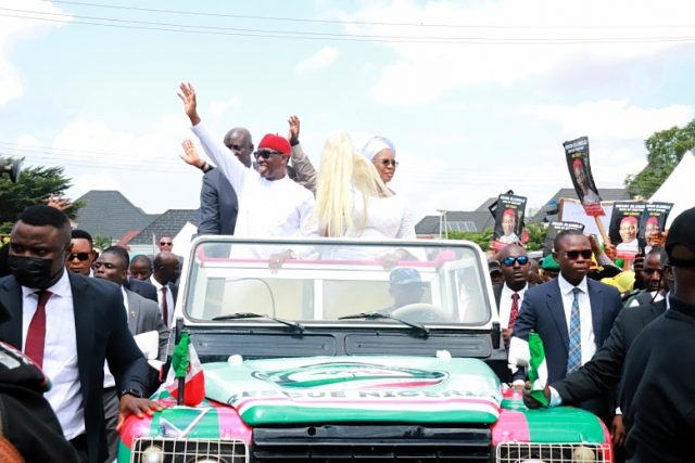 Delta Governor, Senator Dr. Ifeanyi Okowa and his wife, Edith, acknowledging cheers from supporters and PDP faithful