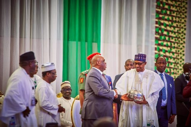 President Buhari chats with President of Afreximbank, Professor Benedict Oramah at the opening of the 2nd AFSNET Conference in Abuja
