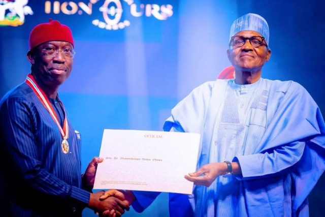 Delta Governor and Vice-Presidential Candidate of PDP, Ifeanyi Okowa, receiving his Award of CON from President Muhammadu Buhari