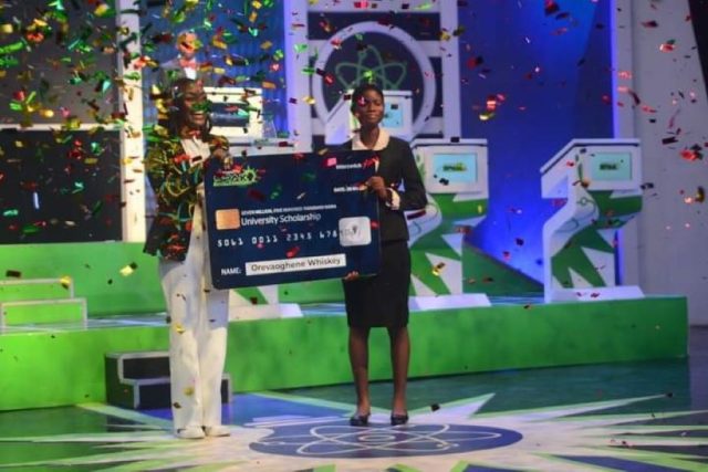 Oremeyi Akah, Chief Customer Experience Officer, Interswitch and Orevaoghene Whiskey, winner of InterswitchSPAK 4.0 during the prize presentation.