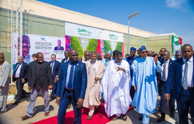President Muhammadu Buhari accompanied by the Jigawa State Governor Muhammed Baderu Abubakar