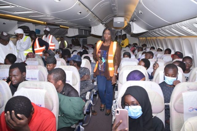 The evacuees on board the military jet C130 with Abike Dabiri-Erewa, CEO of Nigerians in Diaspora Commission