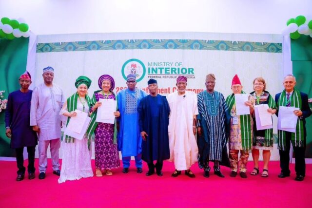 Vice President Osinbajo with some of the 385 Foreign Nationals naturalized in Nigeria
