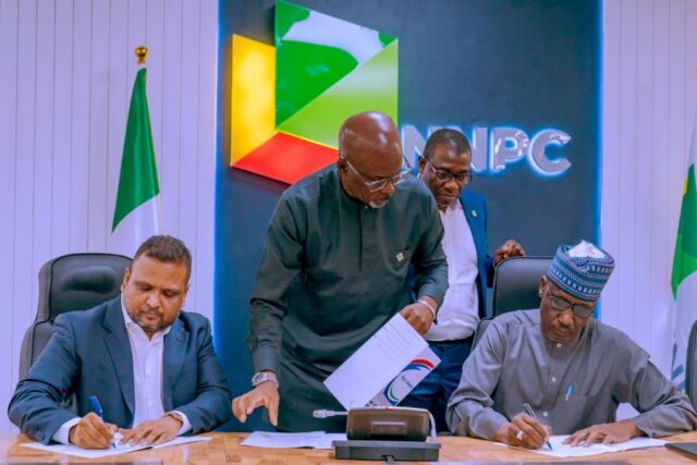 NNPC's GCEO Mele Kyari with MD. CEO, Africa Indorama Energy, Manish Mundra during MoU signing