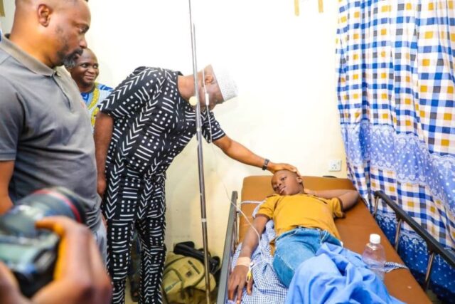 Biodun Oyebanji, Ekiti State Governor with one of the rescued students in hospital
