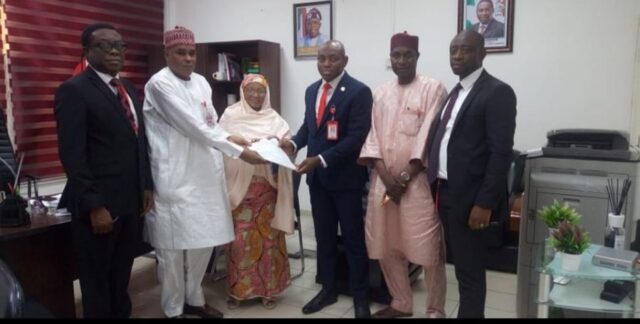 The Abuja Zonal Command of the EFCC handing over the documents to representatives of the pensioners