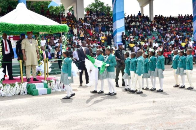 The representative of Delta Governor, and Deputy Governor, Sir Monday Onyeme, taking National Salute at the 2024 Children's Day celebration at the Cenotaph in Asaba on Monday.