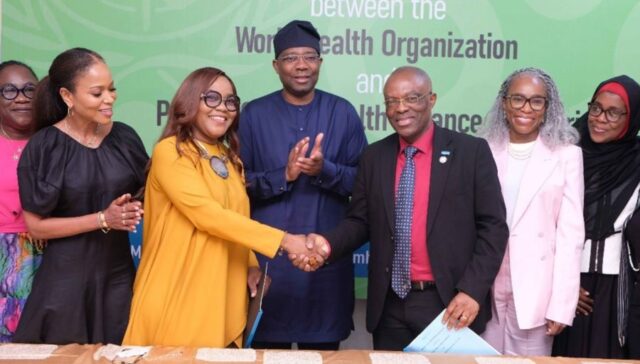 Handshake after signing of MoU to adopt a PHC to improve health indcies in Nigeria
