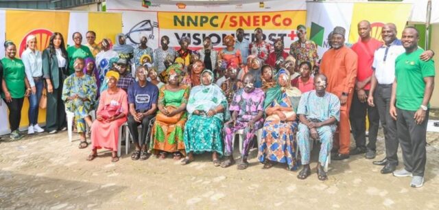 A cross section of beneficiaries and some Shell staff at the NNPC, SNEPCo Vision First Plus programme in Bariga Local Council
