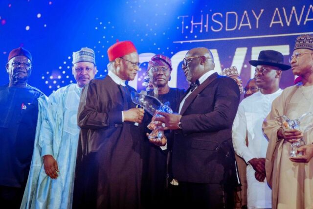 Oborevwori receives his Award from former Commonwealth Secretary- General, Chief Emeka Anyaoku