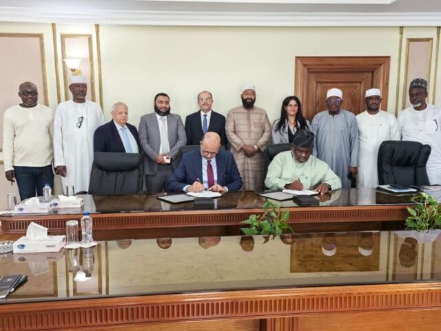 Executive Chairman Niger Foods, Sammy Adigun and Managing Director Arab Contractors, Engr. Mohammed Eledaros sign the agric development deal in Cairo, Egypt.