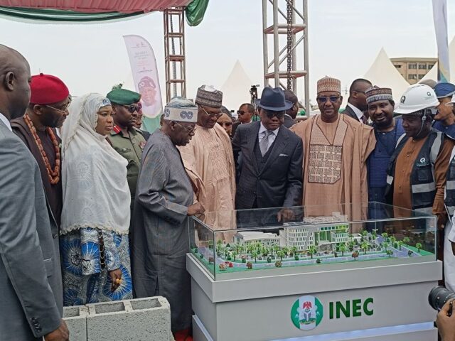 President Bola Tinubu admires the Artist impression of the new headquarters annex building of the Independent National Electoral Commission
