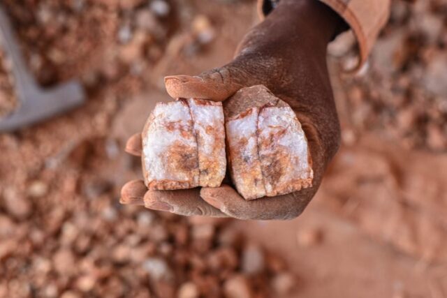 Broken lithium scaled. A miner holds a piece of lithium ore in Kaduna State -Photo- Sadiq Mustapha
