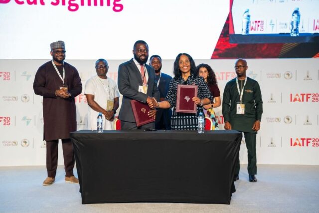 Mr. Ayo Sotinrin and Mrs. Kanayo Awani in handsake after the BOA, Afreximbank financing deal was signed