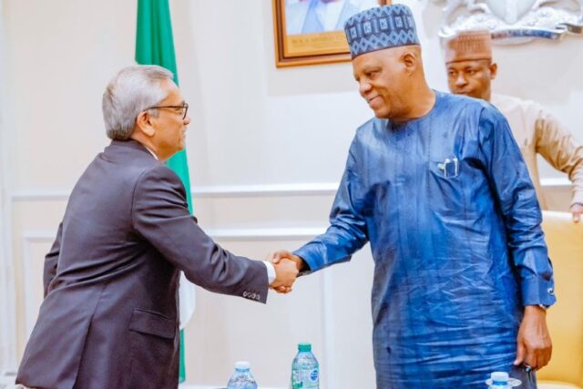 Managing Director-CEO, Mr. RCM Reddy in handshake with VP Shettima