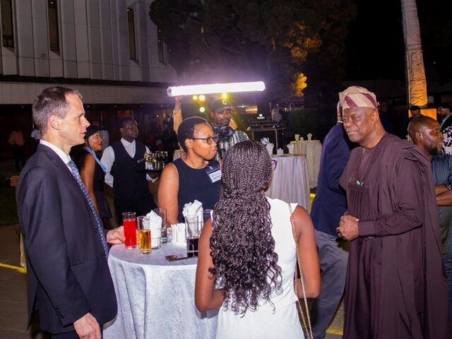 Wale Edun, Minister of Finance and Coordinating Minister of the Economy chat with a delegate at the G-24 meeting