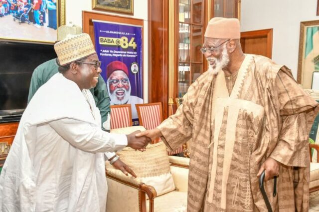 INEC's Prof. Amupitan (L) greets former Head of State and Chairman of the National Peace Committee (NPC), General Abdulsalam Abubakar (rtd)
