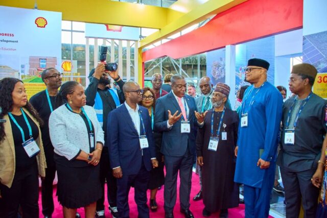 Shell leaders and other dignitaries at the Shell booth during the ministerial tour marking the opening of Nigerian Content Day