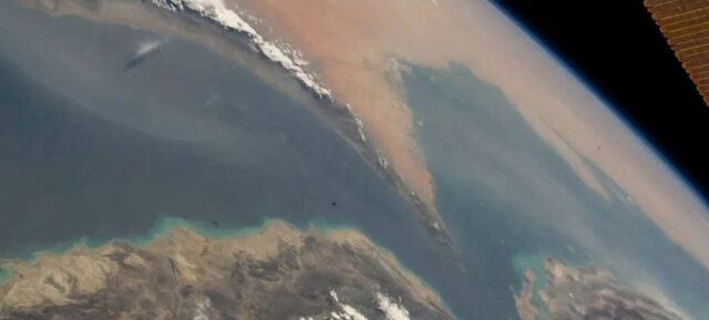A satellite photo shows the strategically important shipping route of the Strait of Hormuz.